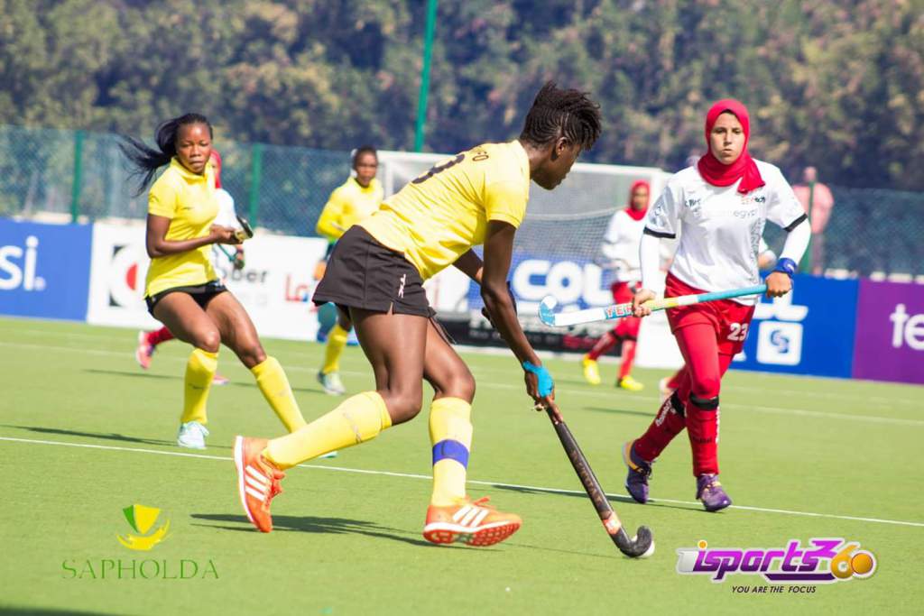 Ghanaian skipper trying to go past her Egyptian counterpart