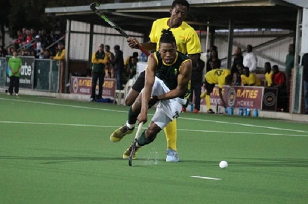 Alfred Ntiamoah tackles his opponent from behind during their match against South Africa