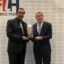 Tayyab Ikram presents IOC Honorary President Thomas Bach with the FIH Lifetime Achievement Award